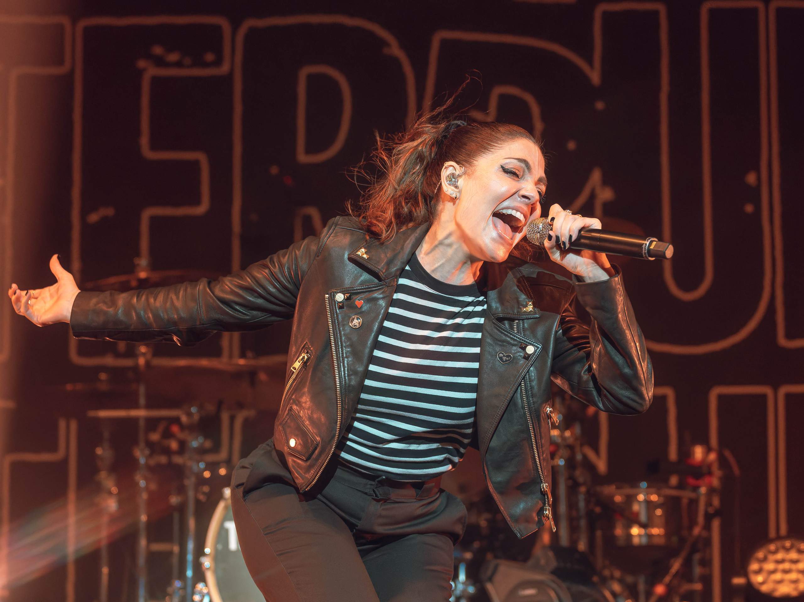 The Interrupters performing at The Rave/Eagles Club in Milwaukee, WI, April 27th, 2024, photography by Ross Harried for Second Crop Music