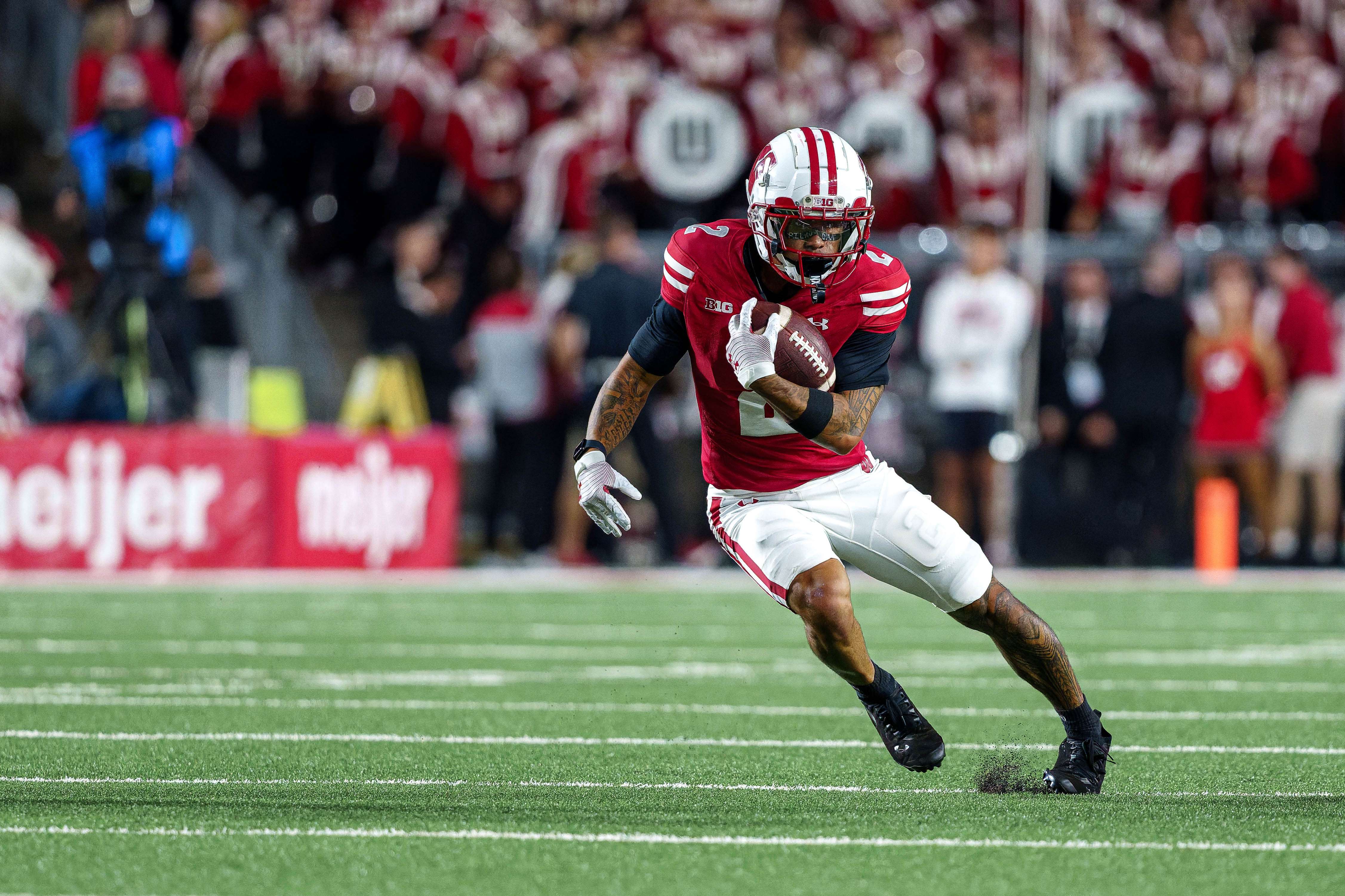 Wisconsin Badgers wide receiver Trech Kekahuna (2) runs up field after catching the ball against the Miami (OH) RedHawks at Camp Randall on August 28, 2025 in Madison, Wisconsin. Photography by Ross Harried for Second Crop Sports.