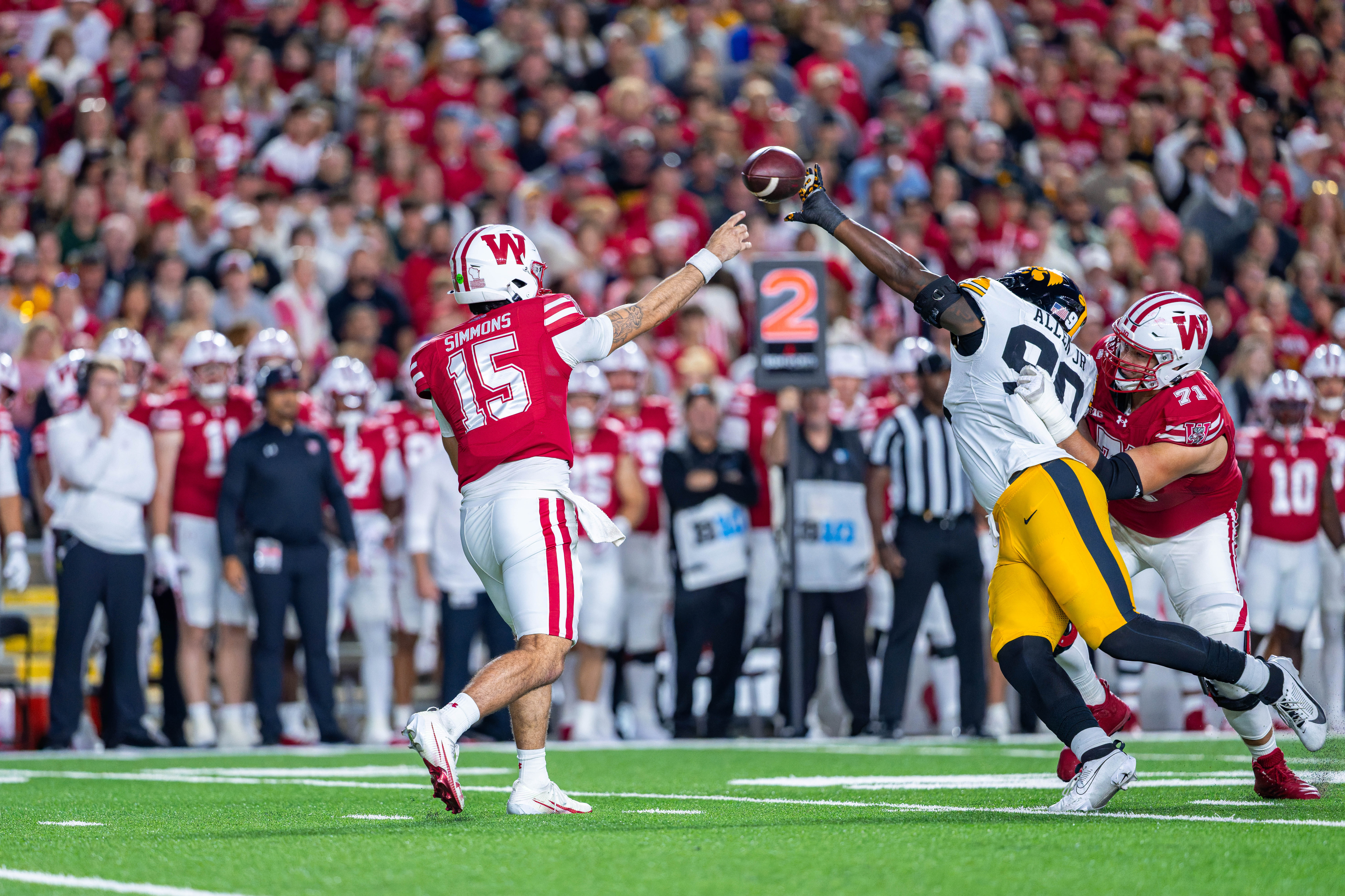 Oct 11, 2025; Madison, Wisconsin, USA; Iowa Hawkeyes defensive end Brian Allen Jr. (90) tips a pass from Wisconsin Badgers quarterback Hunter Simmons (15) in the first quarter at Camp Randall Stadium. Mandatory Credit Photography by Ross Harried for Second Crop Sports.