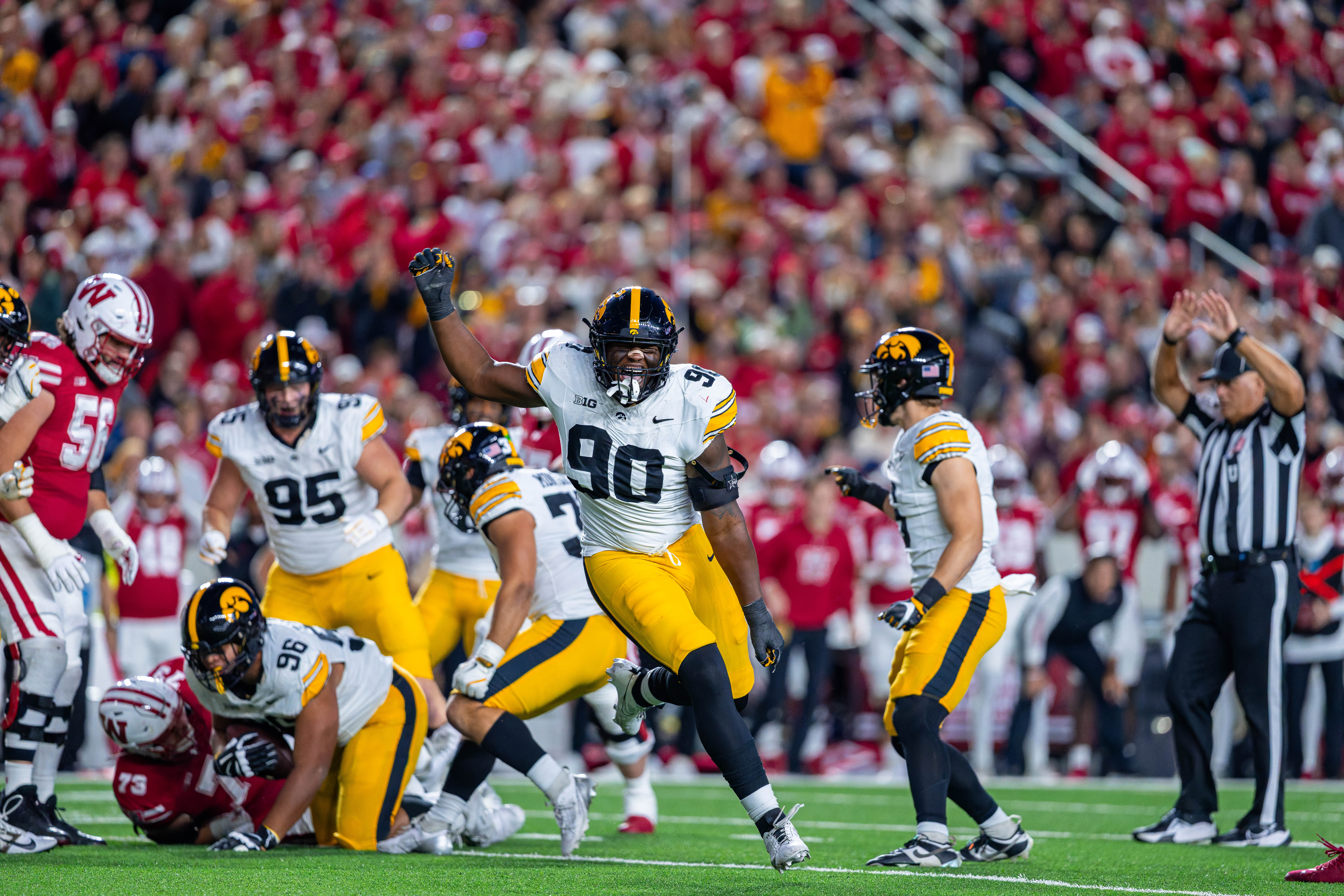 Oct 11, 2025; Madison, Wisconsin, USA; Iowa Hawkeyes defensive end Brian Allen Jr. (90) celebrates after a ball he tipped was intercepted by a teammate against the Wisconsin Badgers in the first quarter at Camp Randall Stadium. Mandatory Credit Photography by Ross Harried for Second Crop Sports.