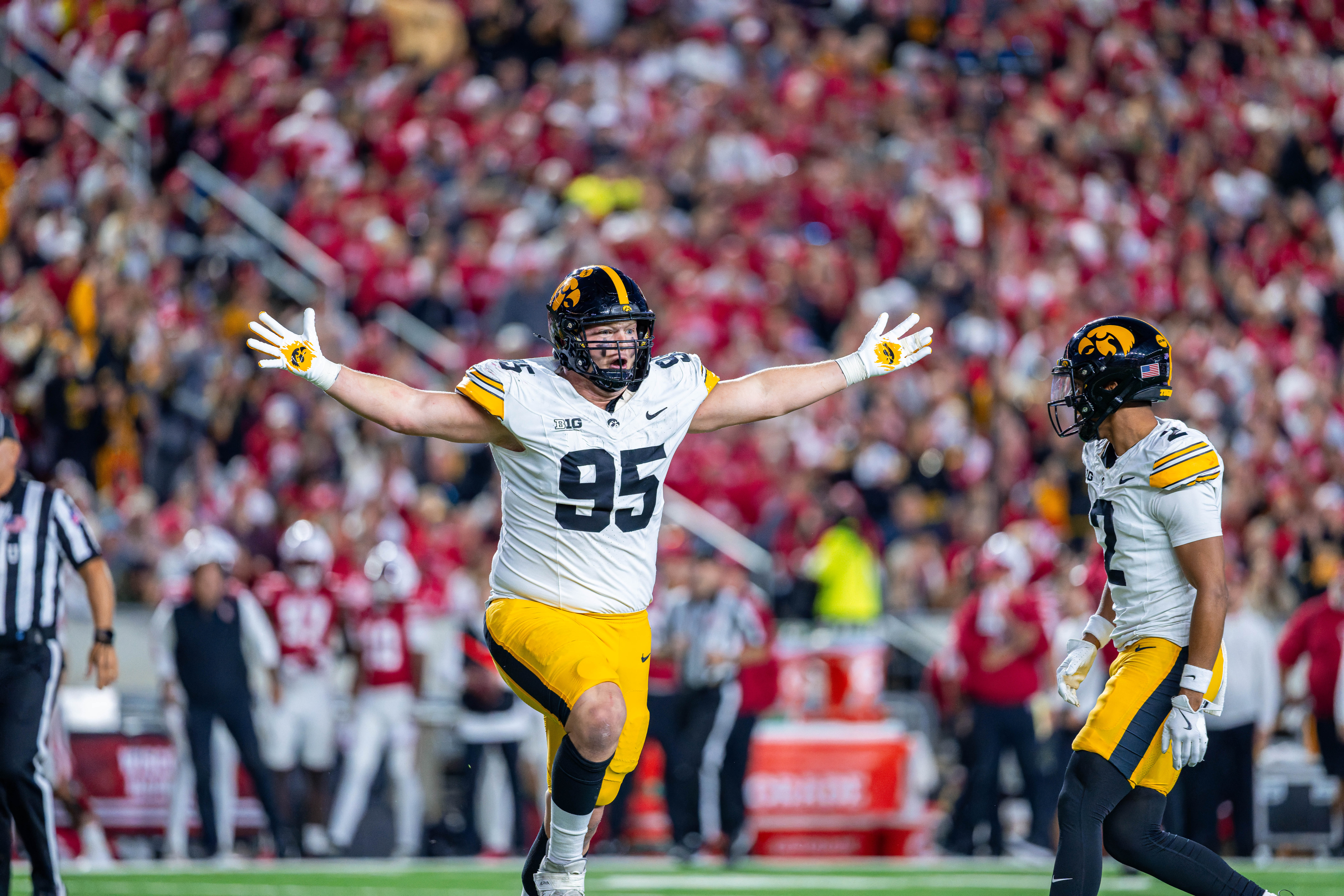 Oct 11, 2025; Madison, Wisconsin, USA; Iowa Hawkeyes defensive lineman Aaron Graves (95) celebrates an interception by a teammate in the first quarter against the Wisconsin Badgers at Camp Randall Stadium. Mandatory Credit Photography by Ross Harried for Second Crop Sports.
