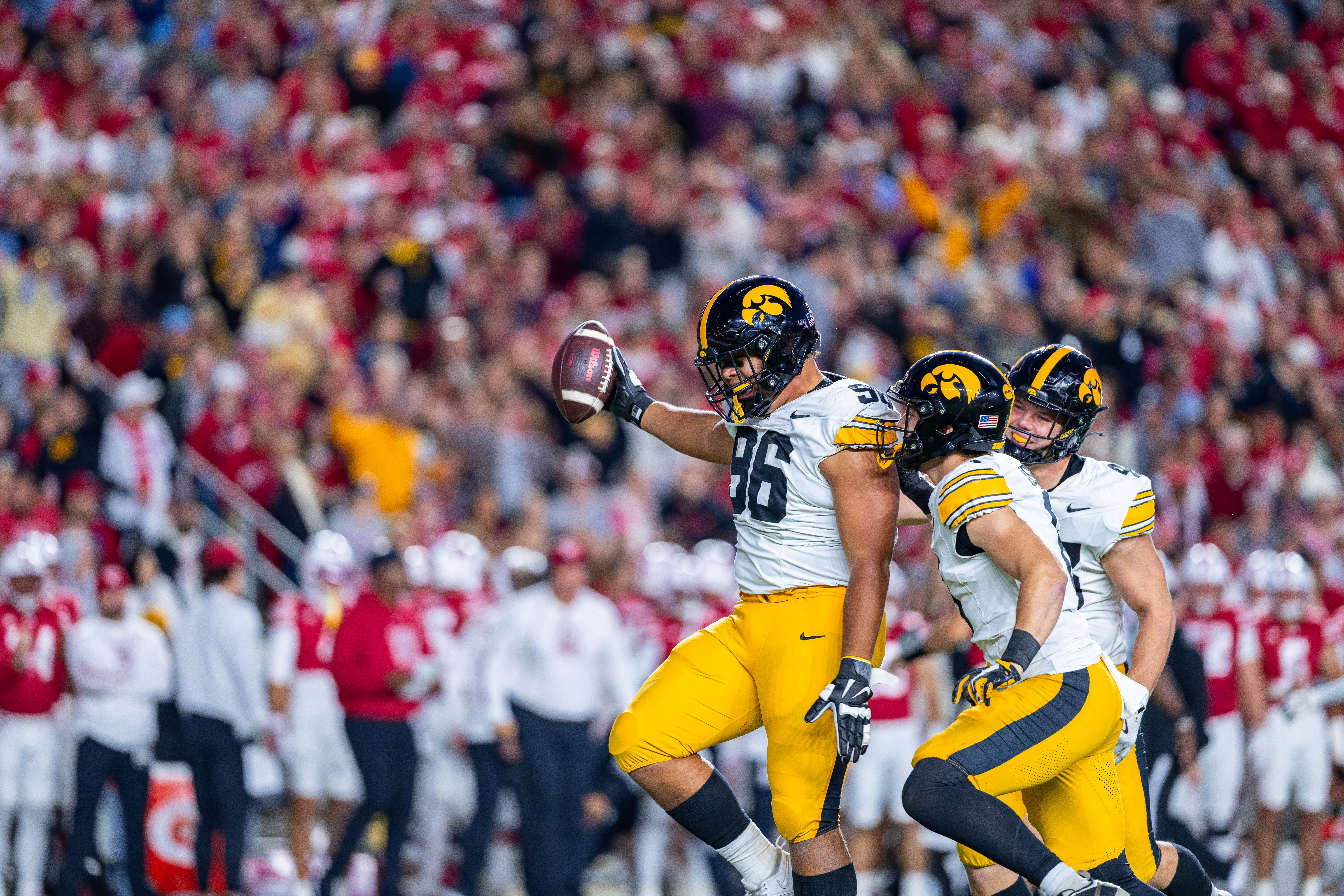 Oct 11, 2025; Madison, Wisconsin, USA; Iowa Hawkeyes defensive lineman Bryce Hawthorne (96) celebrates with teammates after intercepting the ball in the first quarter against the Wisconsin Badgers at Camp Randall Stadium. Mandatory Credit Photography by Ross Harried for Second Crop Sports.