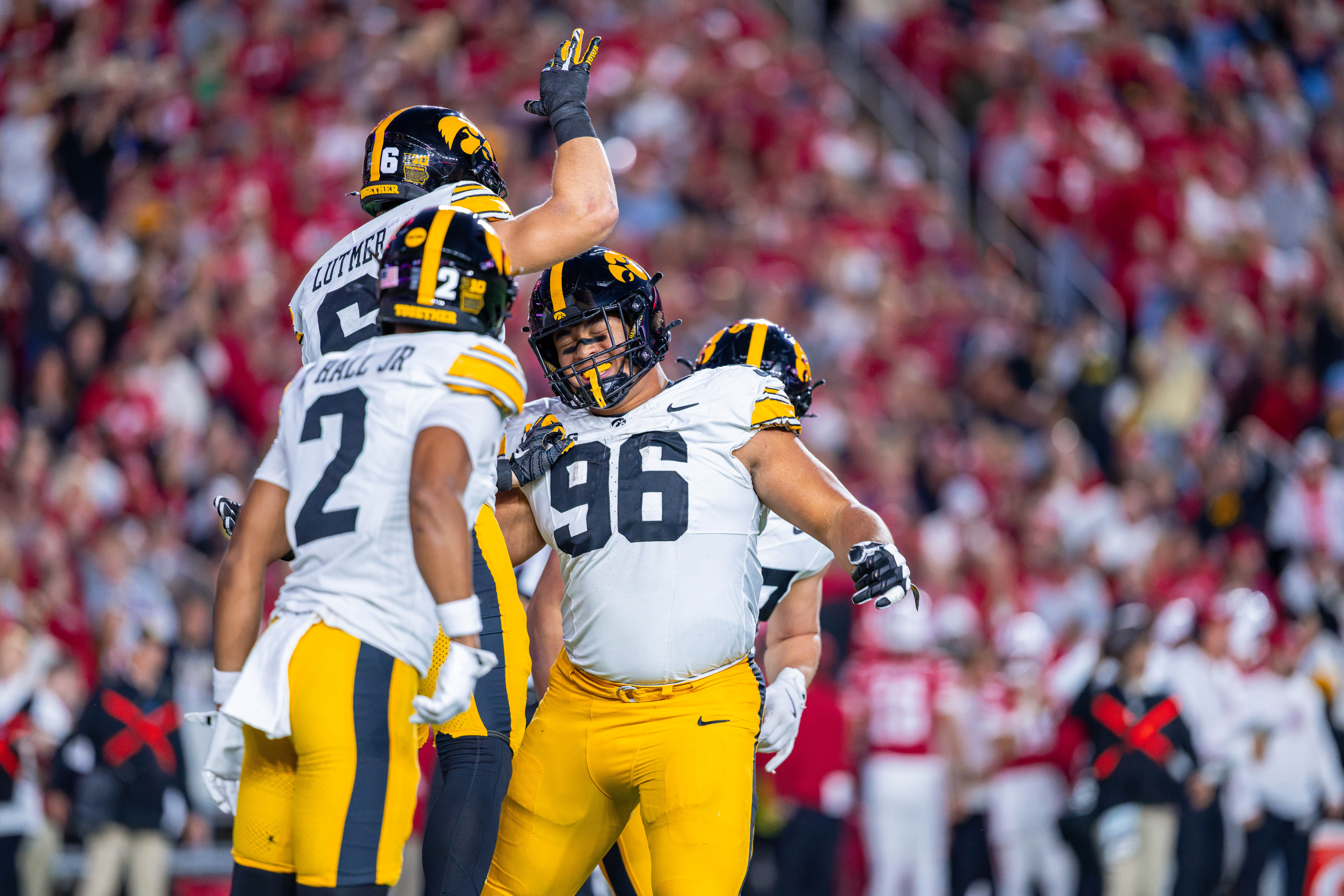 Oct 11, 2025; Madison, Wisconsin, USA; Iowa Hawkeyes defensive lineman Bryce Hawthorne (96) celebrates with teammates after intercepting the ball in the first quarter against the Wisconsin Badgers at Camp Randall Stadium. Mandatory Credit Photography by Ross Harried for Second Crop Sports.