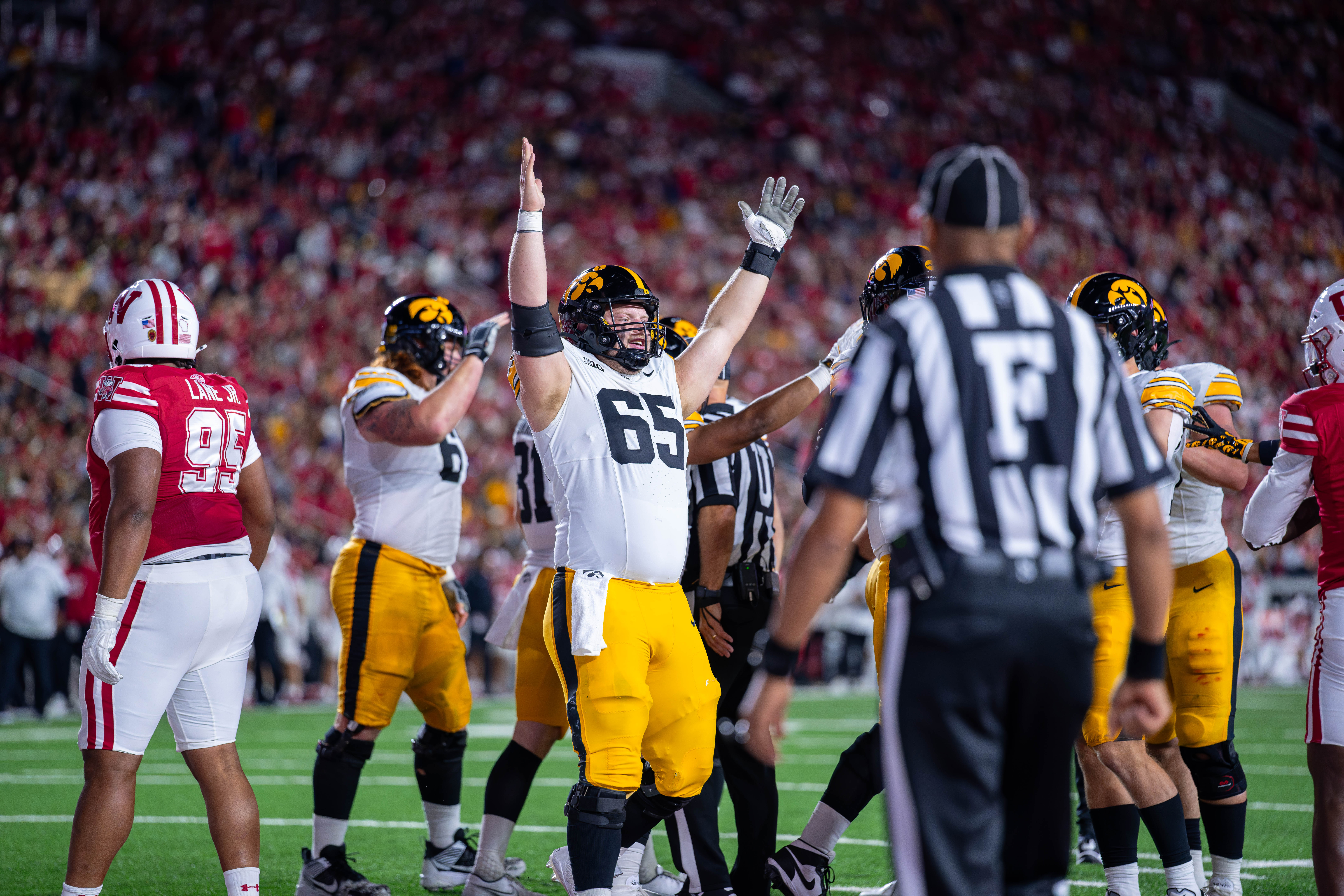 Oct 11, 2025; Madison, Wisconsin, USA; Iowa Hawkeyes offensive lineman Logan Jones (65) celebrates a touchdown in the first quarter against the Wisconsin Badgers at Camp Randall Stadium. Mandatory Credit Photography by Ross Harried for Second Crop Sports.