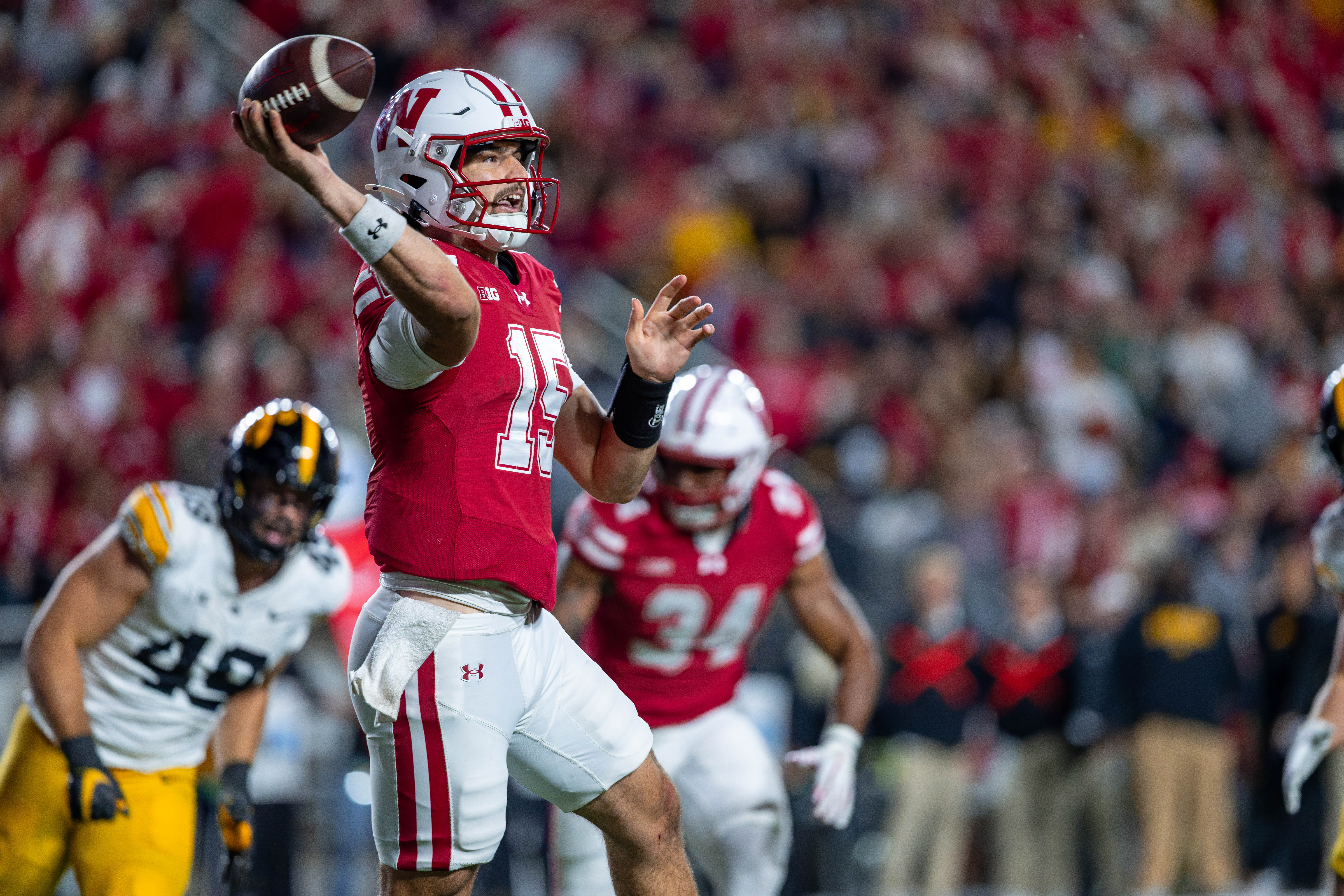 Oct 11, 2025; Madison, Wisconsin, USA; Wisconsin Badgers quarterback Hunter Simmons (15) looks to pass in the first half against the Iowa Hawkeyes at Camp Randall Stadium. Mandatory Credit Photography by Ross Harried for Second Crop Sports.