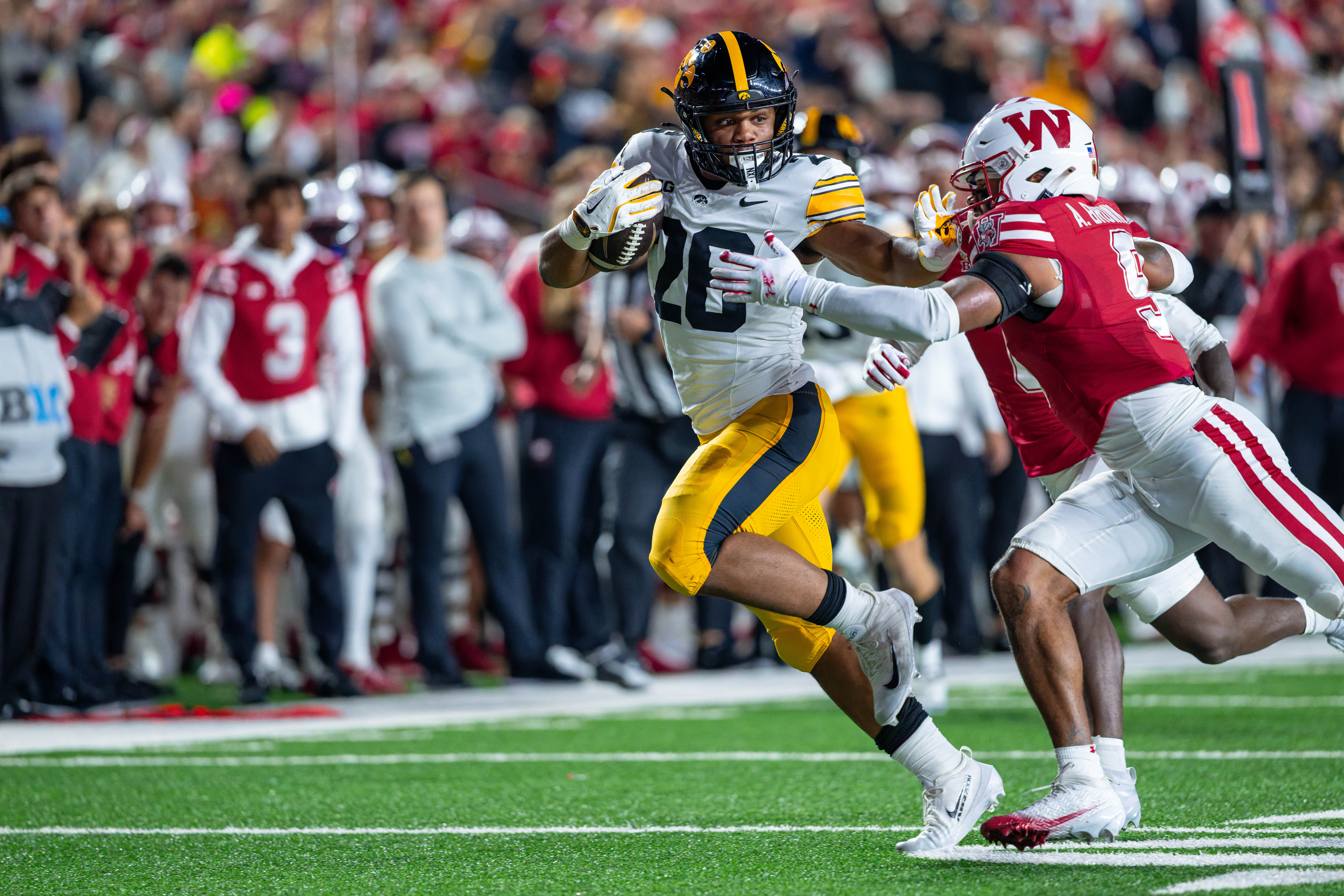 Oct 11, 2025; Madison, Wisconsin, USA; Iowa Hawkeyes running back Xavier Williams (26) runs the ball in the second half against the Wisconsin Badgers at Camp Randall Stadium. Mandatory Credit Photography by Ross Harried for Second Crop Sports.