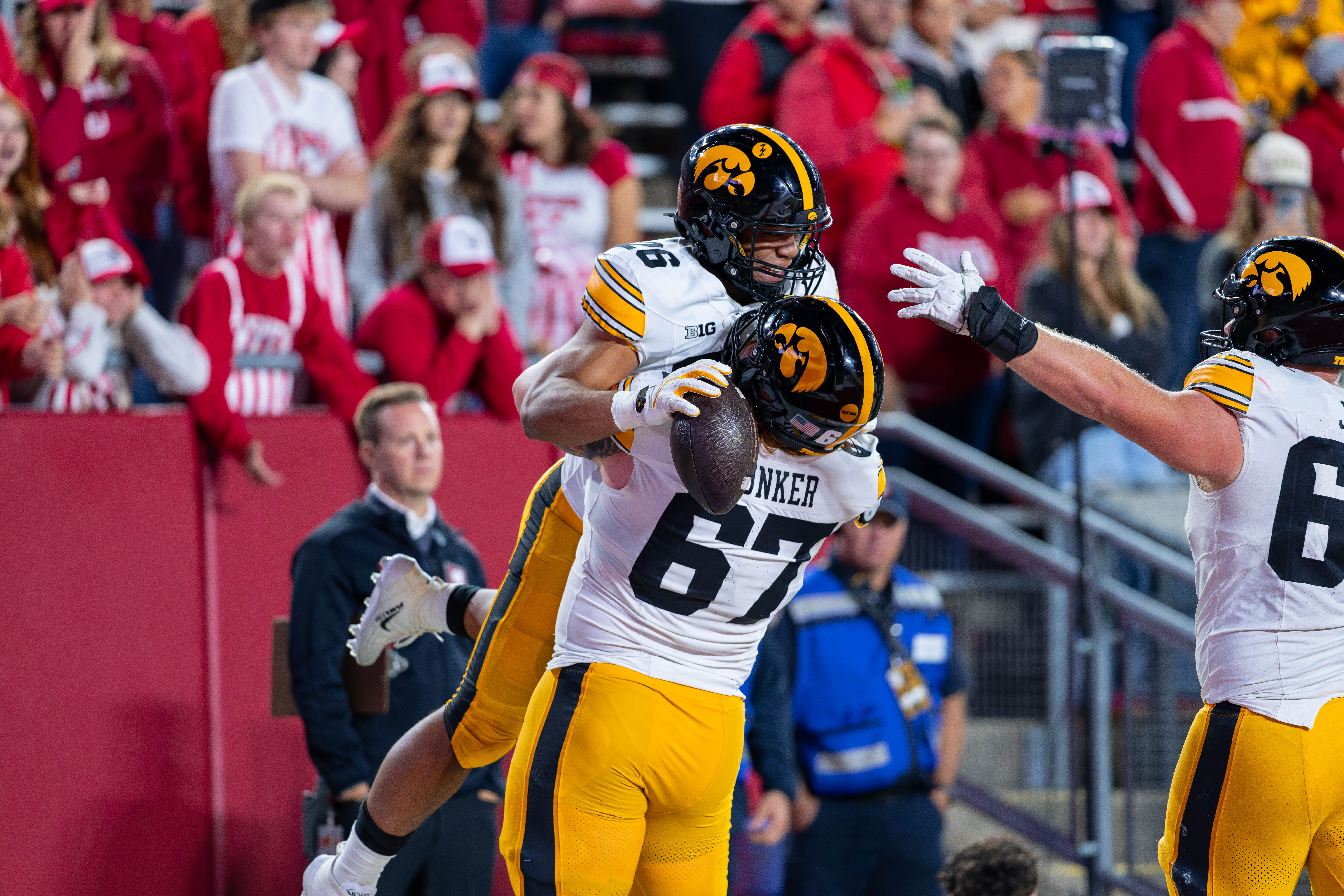 Oct 11, 2025; Madison, Wisconsin, USA; Iowa Hawkeyes running back Xavier Williams (26) celebrates a touchdown with offensive lineman Gennings Dunker (67) in the second half against the Wisconsin Badgers at Camp Randall Stadium. Mandatory Credit Photography by Ross Harried for Second Crop Sports.