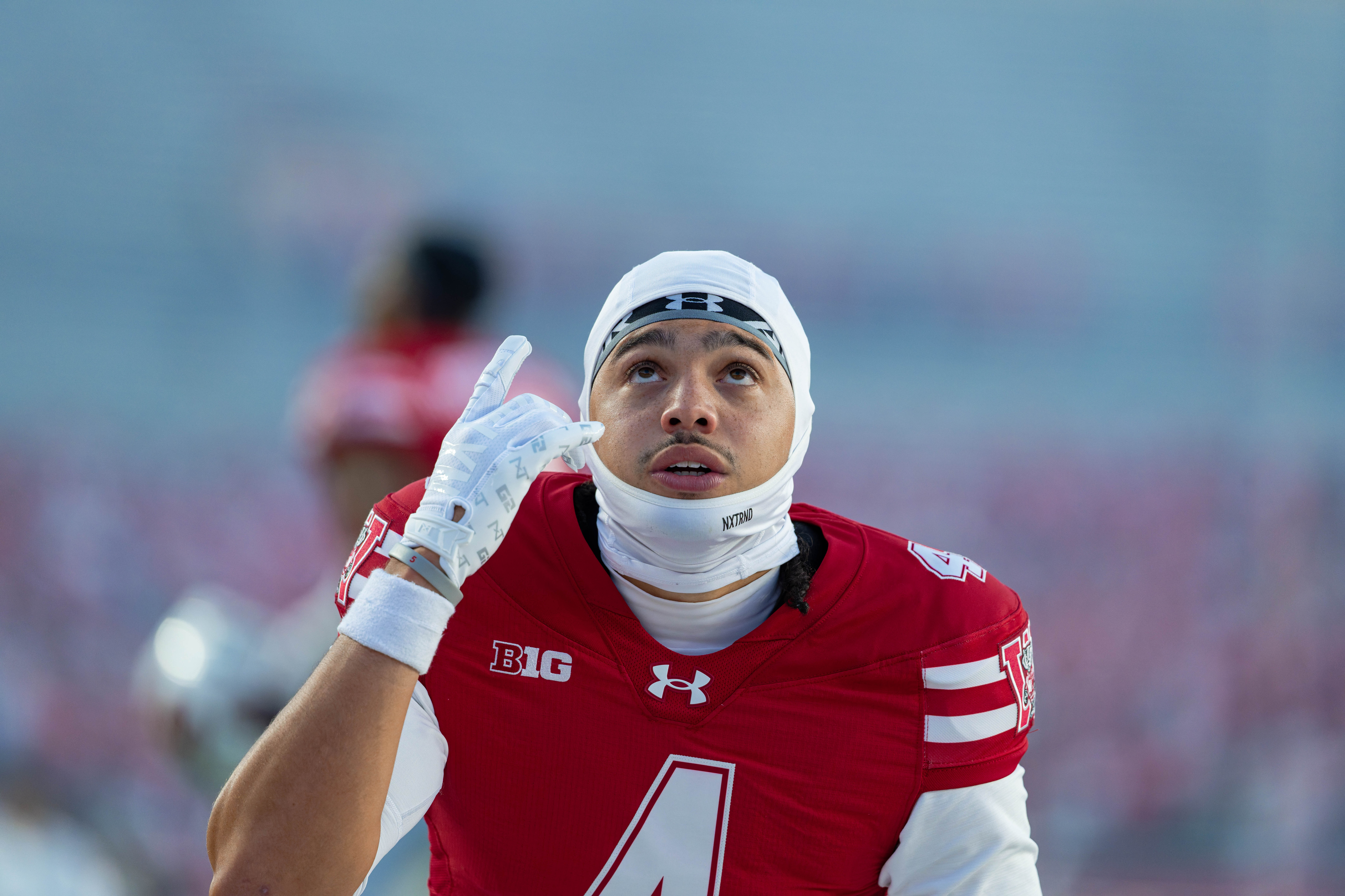 Oct 11, 2025; Madison, Wisconsin, USA; Wisconsin Badgers wide receiver Jayden Ballard (4) takes a knee before a game agains the Iowa Hawkeyes at Camp Randall Stadium. Mandatory Credit Photography by Ross Harried for Second Crop Sports.