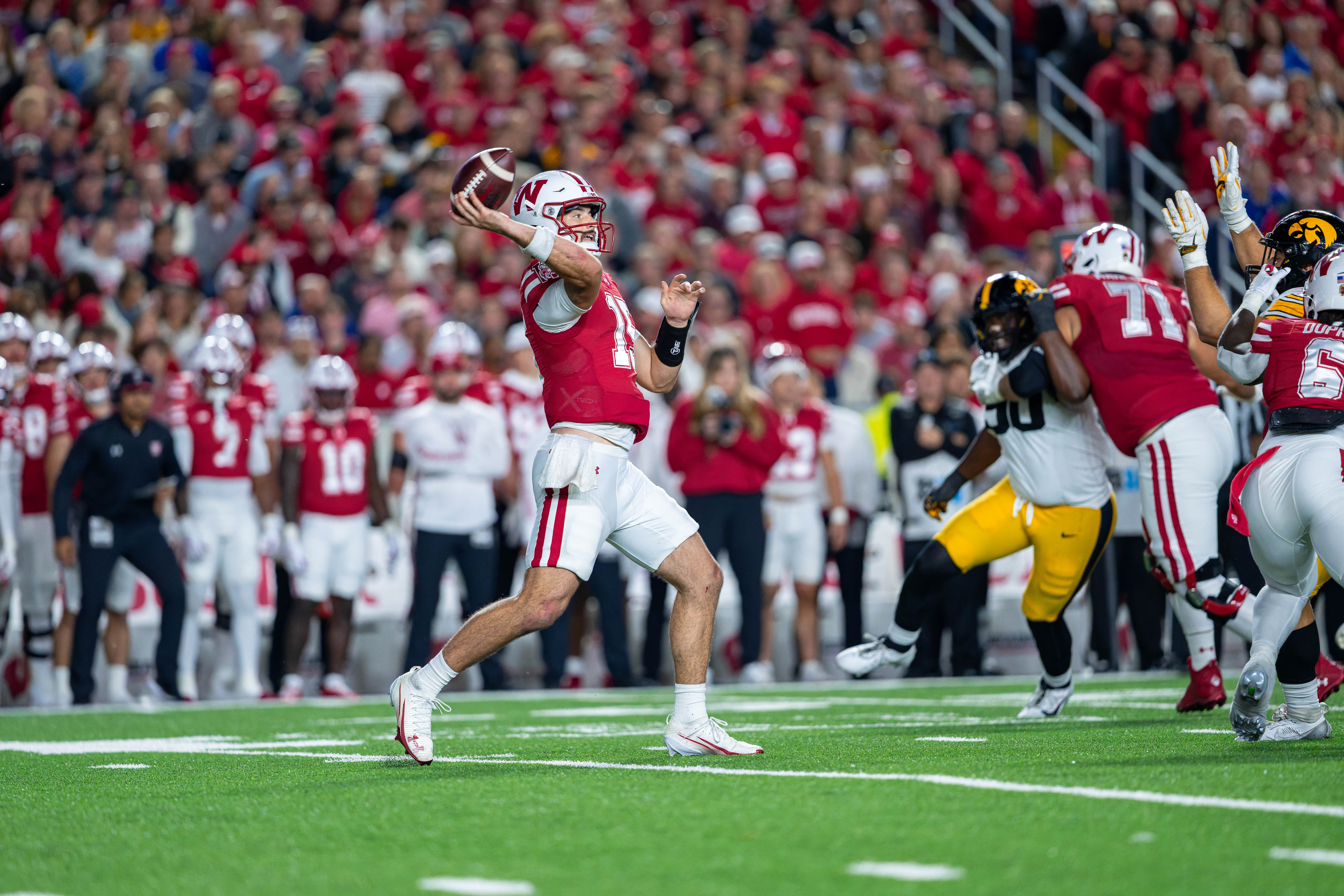 Oct 11, 2025; Madison, Wisconsin, USA; Wisconsin Badgers quarterback Hunter Simmons (15) attempts a pass in the first half against the Iowa Hawkeyes at Camp Randall Stadium. Mandatory Credit Photography by Ross Harried for Second Crop Sports.