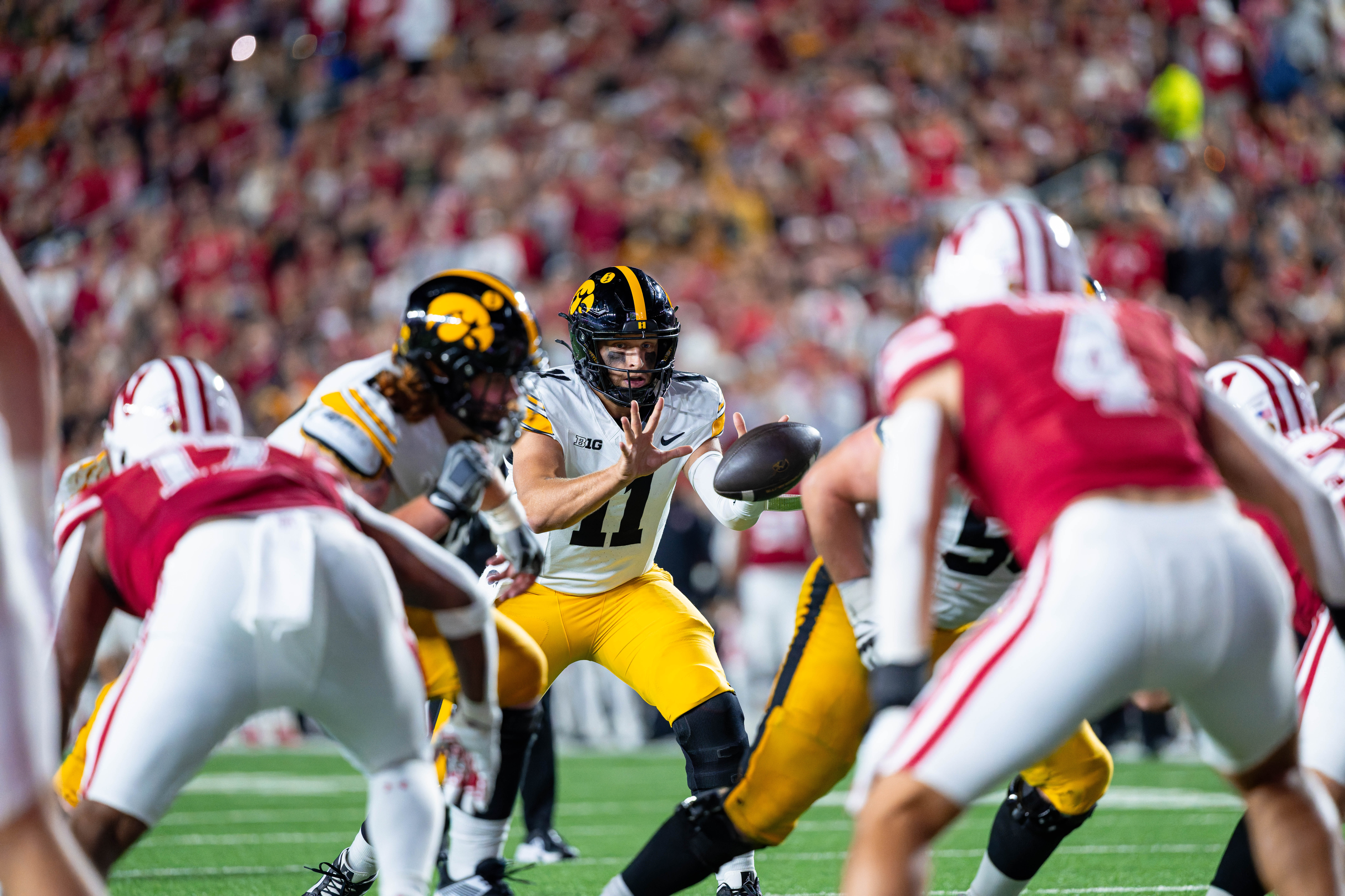 Oct 11, 2025; Madison, Wisconsin, USA; Iowa Hawkeyes quarterback Mark Gronowski (11) takes a snap i the first half against the Wisconsin Badgers at Camp Randall Stadium. Mandatory Credit Photography by Ross Harried for Second Crop Sports.