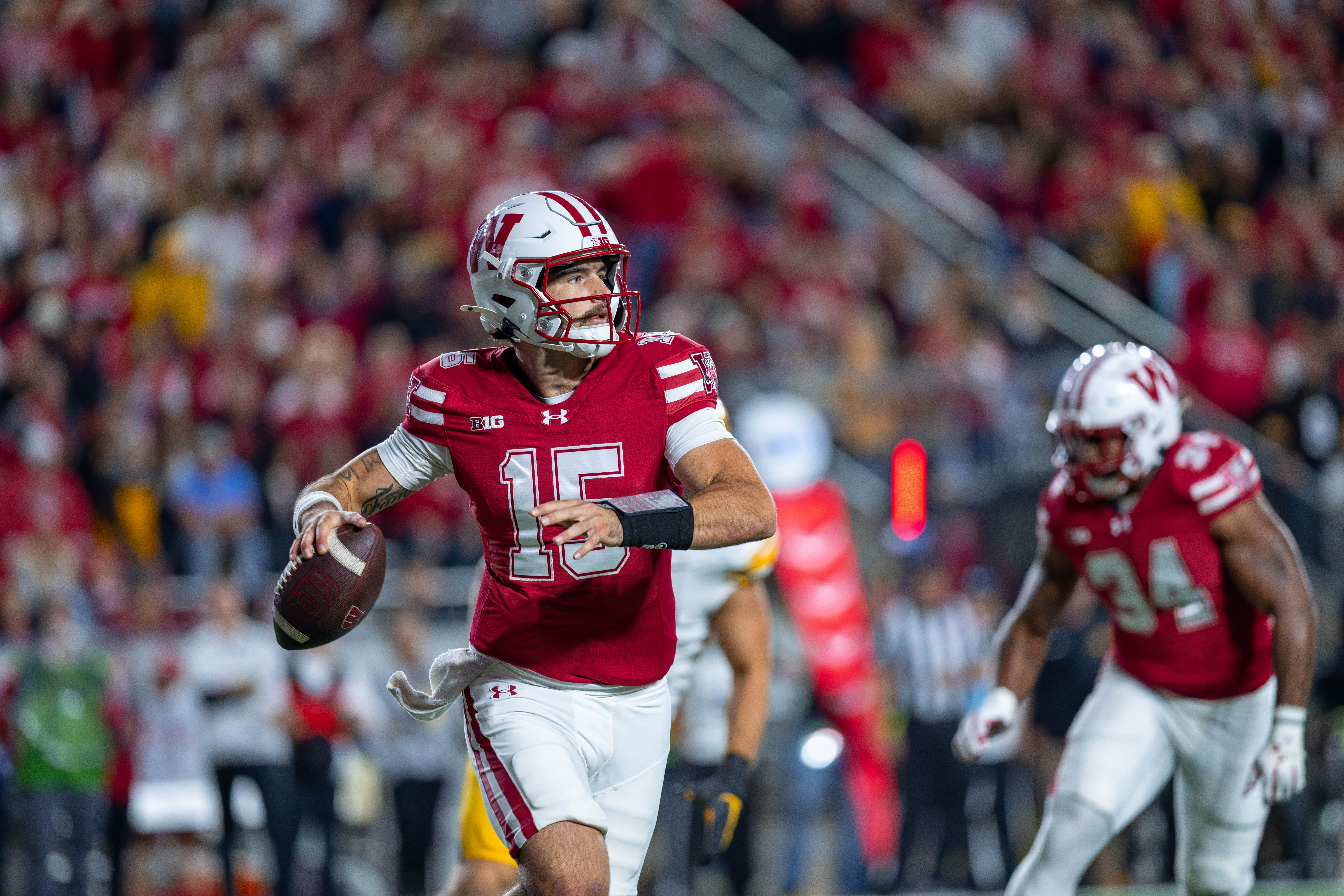 Oct 11, 2025; Madison, Wisconsin, USA; Wisconsin Badgers quarterback Hunter Simmons (15) looks to pass in the first half against the Iowa Hawkeyes at Camp Randall Stadium. Mandatory Credit Photography by Ross Harried for Second Crop Sports.