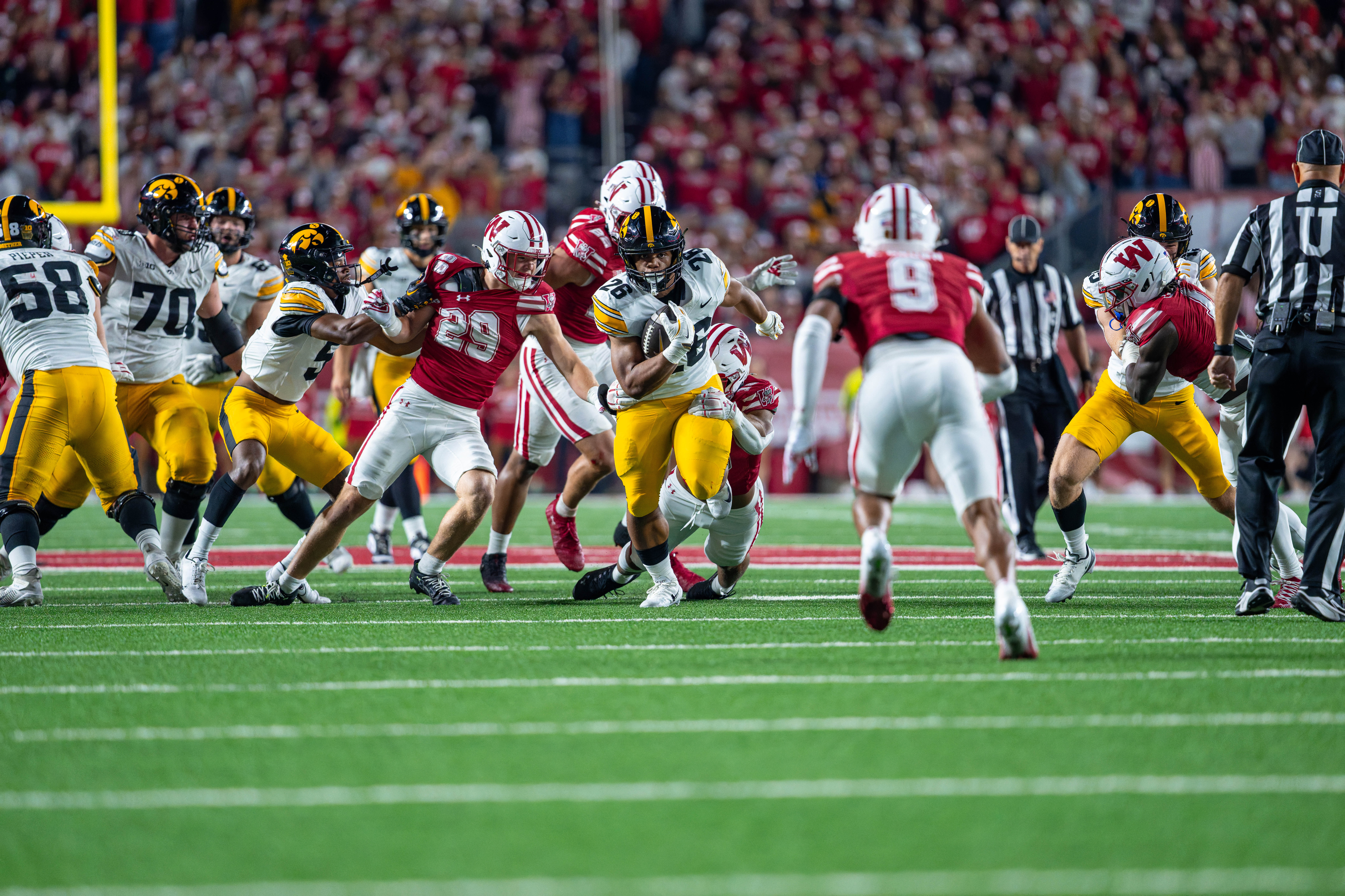 Oct 11, 2025; Madison, Wisconsin, USA; Iowa Hawkeyes running back Xavier Williams (26) runs the ball in the second half against the Wisconsin Badgers at Camp Randall Stadium. Mandatory Credit Photography by Ross Harried for Second Crop Sports.
