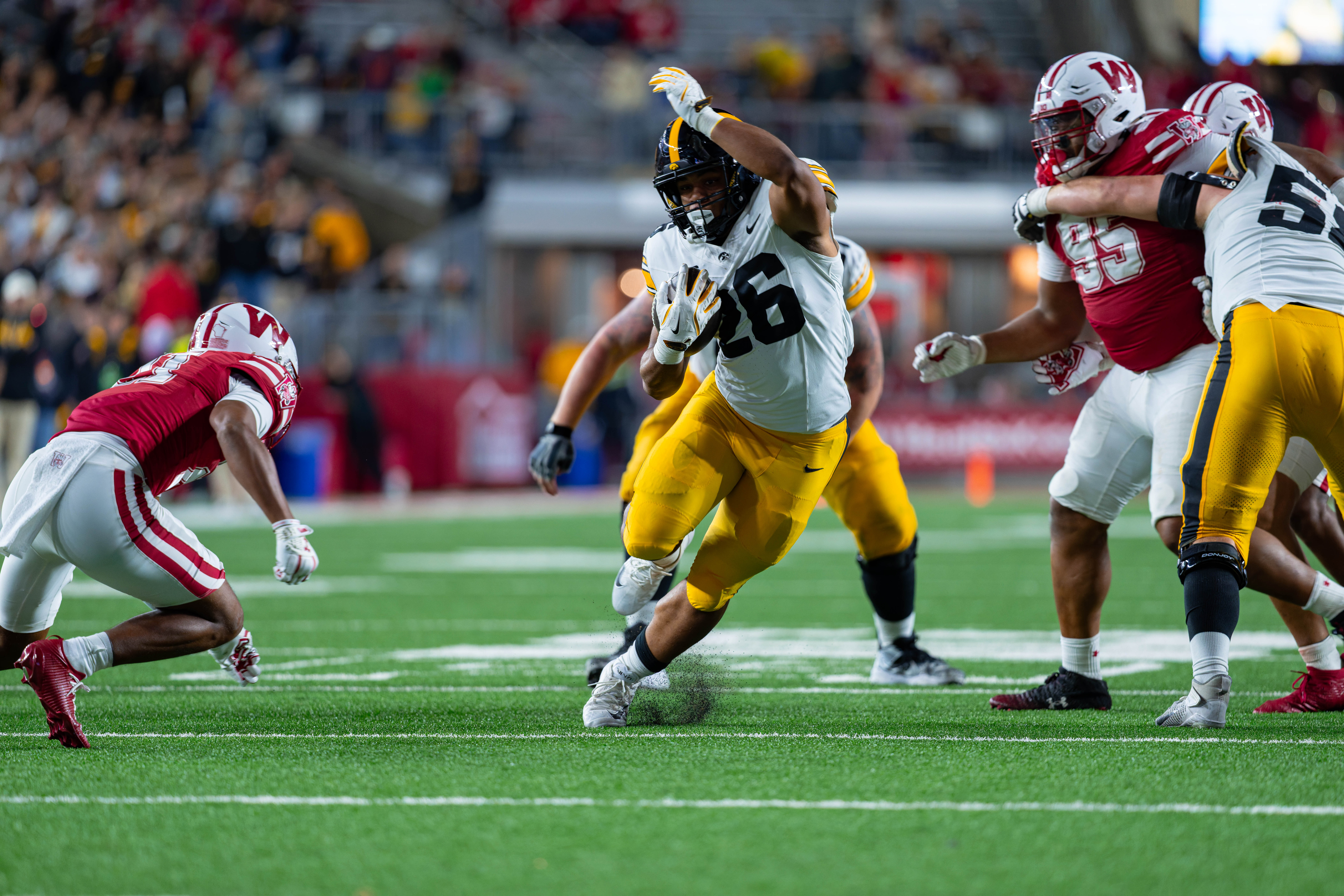 Oct 11, 2025; Madison, Wisconsin, USA; Iowa Hawkeyes running back Xavier Williams (26) runs the ball in the second half against the Wisconsin Badgers at Camp Randall Stadium. Mandatory Credit Photography by Ross Harried for Second Crop Sports.