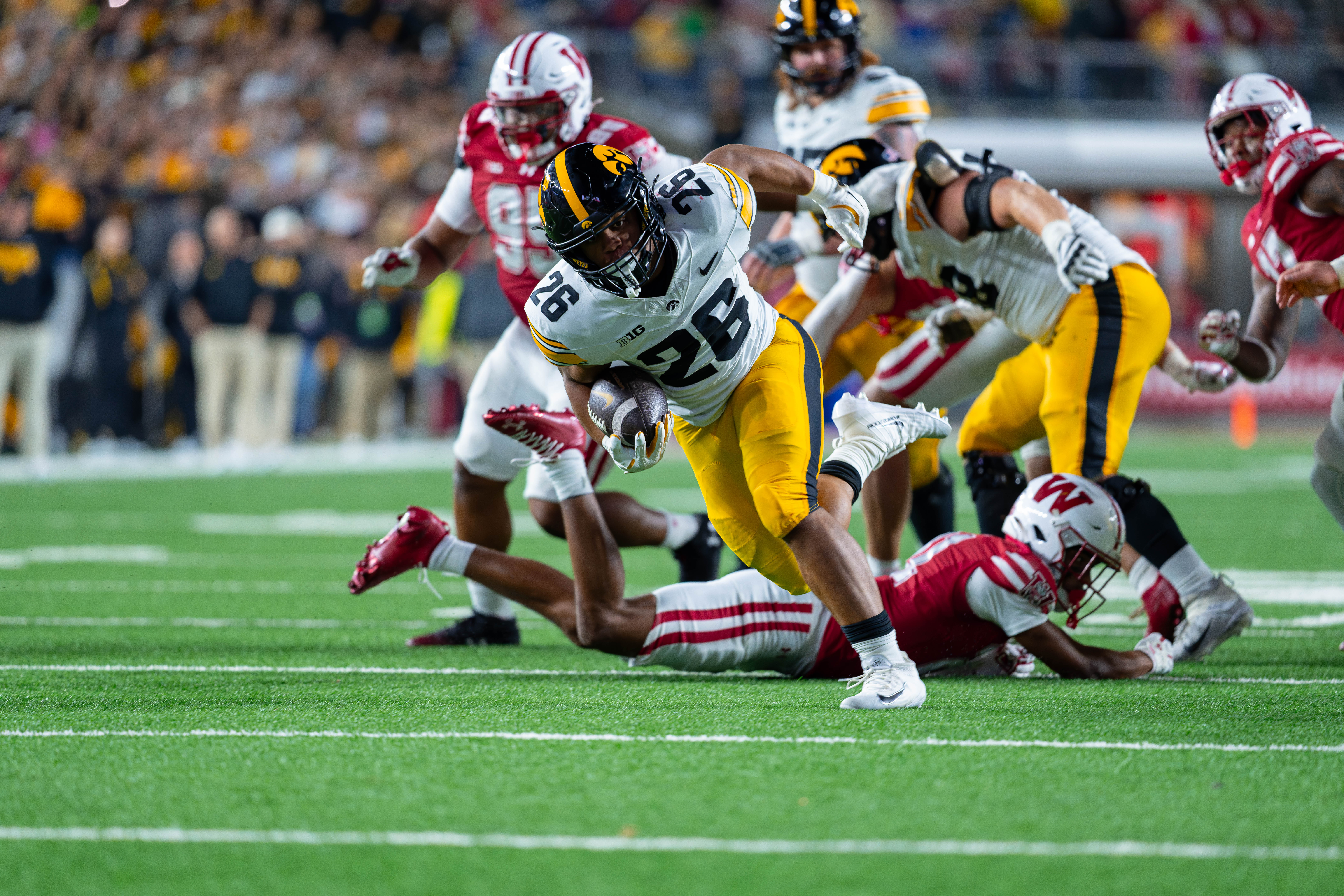 Oct 11, 2025; Madison, Wisconsin, USA; Iowa Hawkeyes running back Xavier Williams (26) runs the ball in the second half against the Wisconsin Badgers at Camp Randall Stadium. Mandatory Credit Photography by Ross Harried for Second Crop Sports.