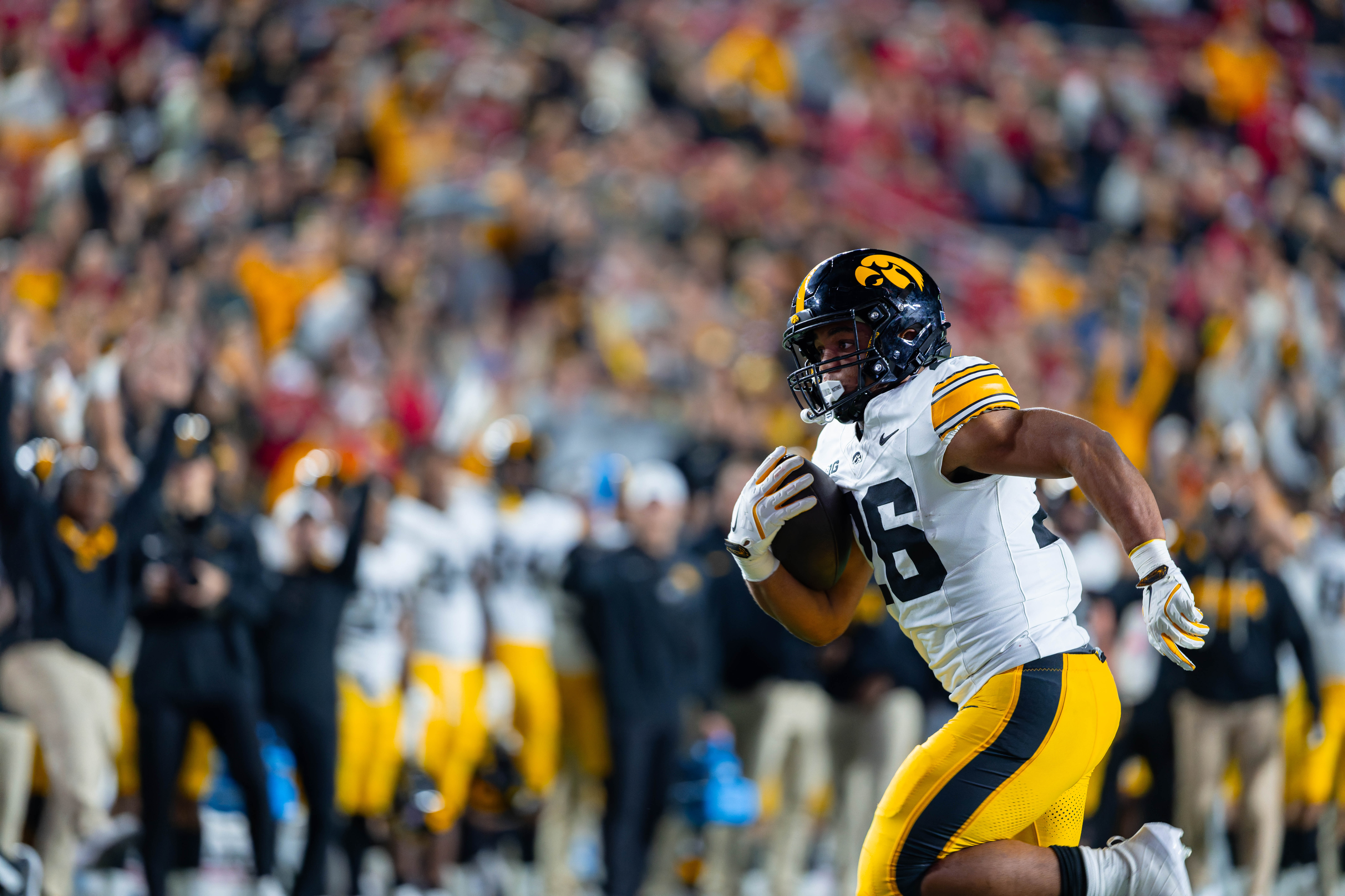 Oct 11, 2025; Madison, Wisconsin, USA; Iowa Hawkeyes running back Xavier Williams (26) runs the ball in the second half against the Wisconsin Badgers at Camp Randall Stadium. Mandatory Credit Photography by Ross Harried for Second Crop Sports.