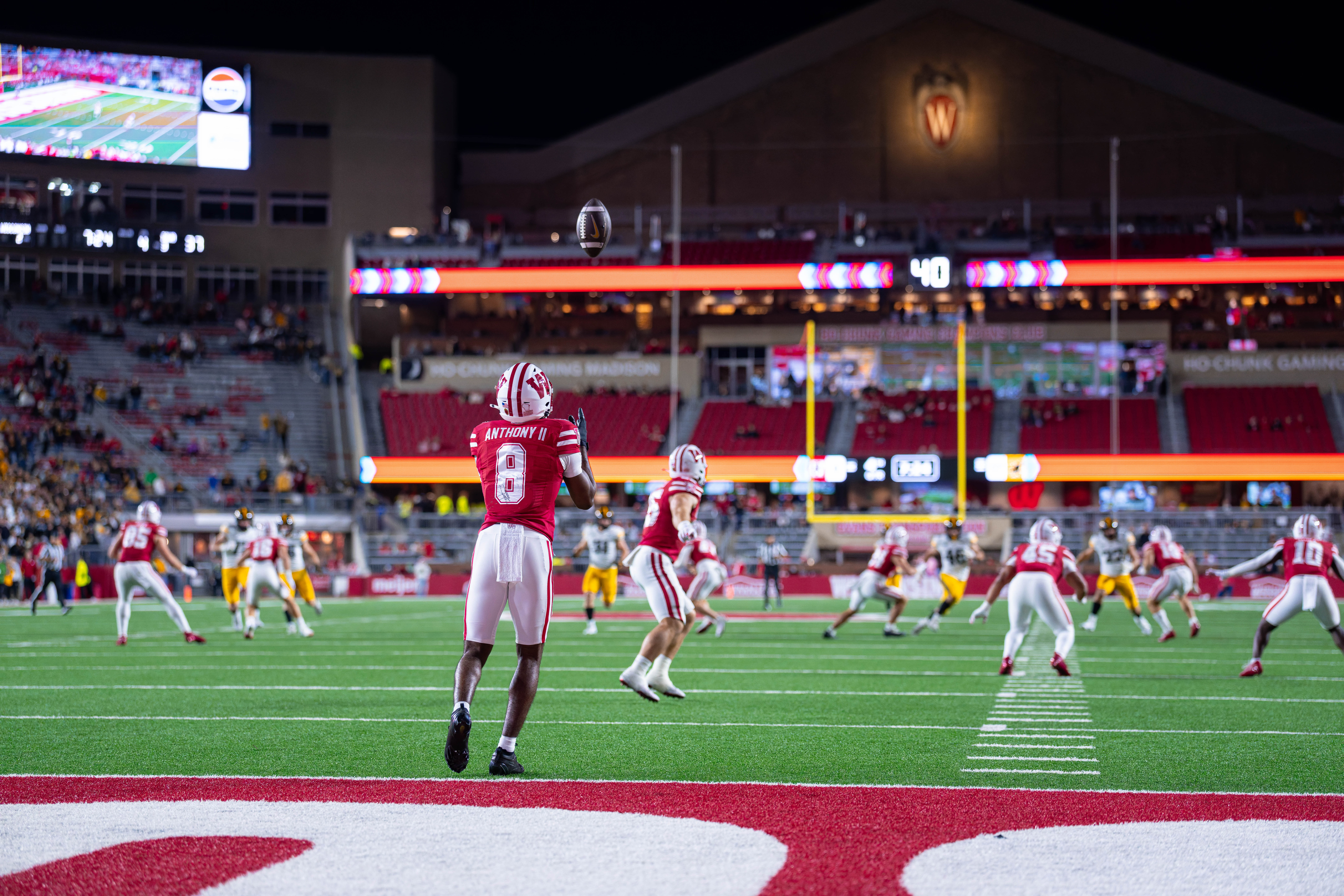 Oct 11, 2025; Madison, Wisconsin, USA; Wisconsin Badgers wide receiver Vinny Anthony II (8) receives a kickoff in the second half against the Iowa Hawkeyes at Camp Randall Stadium. Mandatory Credit Photography by Ross Harried for Second Crop Sports.