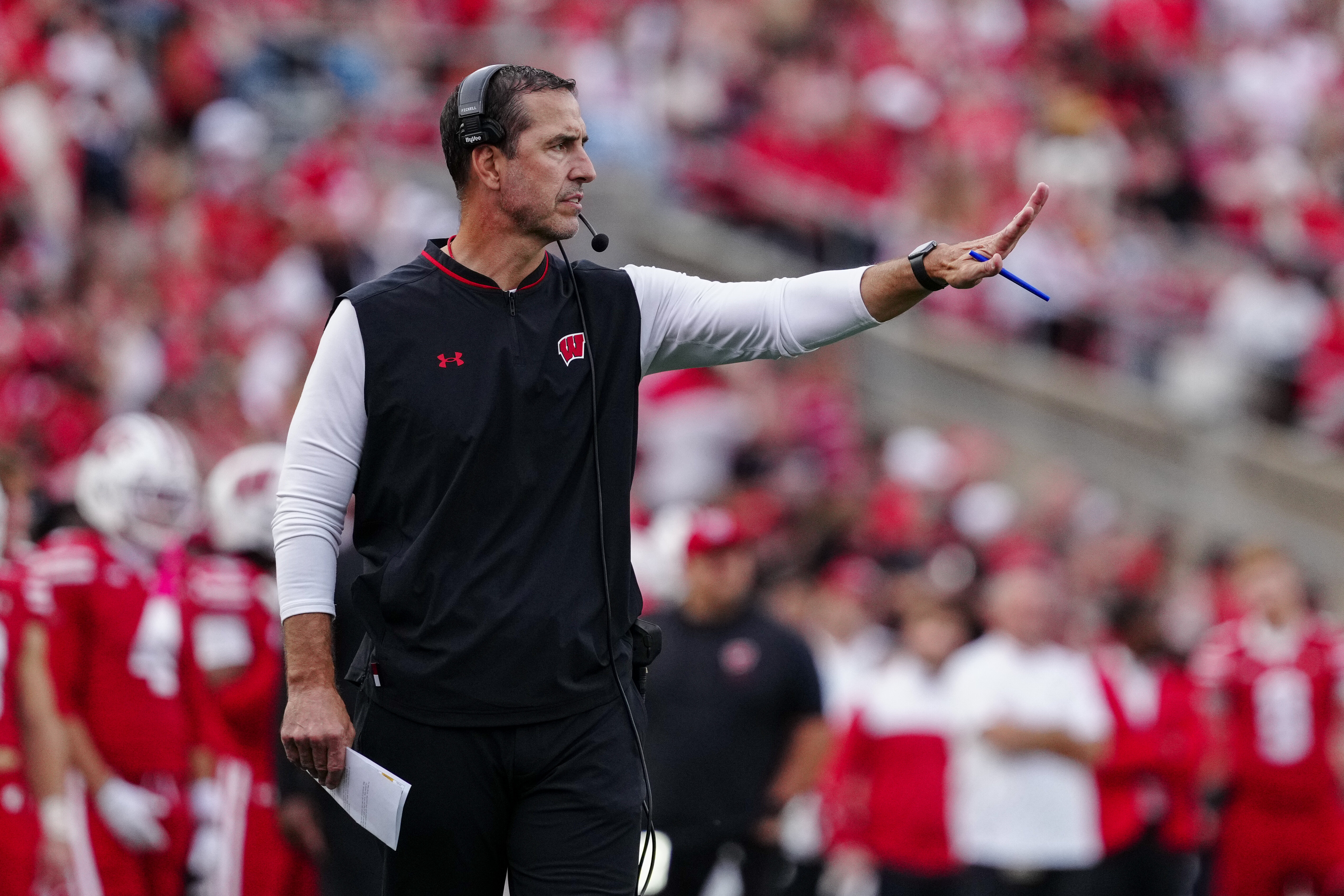 Oct 18, 2025; Madison, Wisconsin, USA; Wisconsin Badgers head coach Luke Fickell signals from the sideline in the second half against the Ohio State Buckeyes at Camp Randall Stadium on October 18, 2025 in Madison, Wisconsin. Photography by Ross Harried for Second Crop Sports.