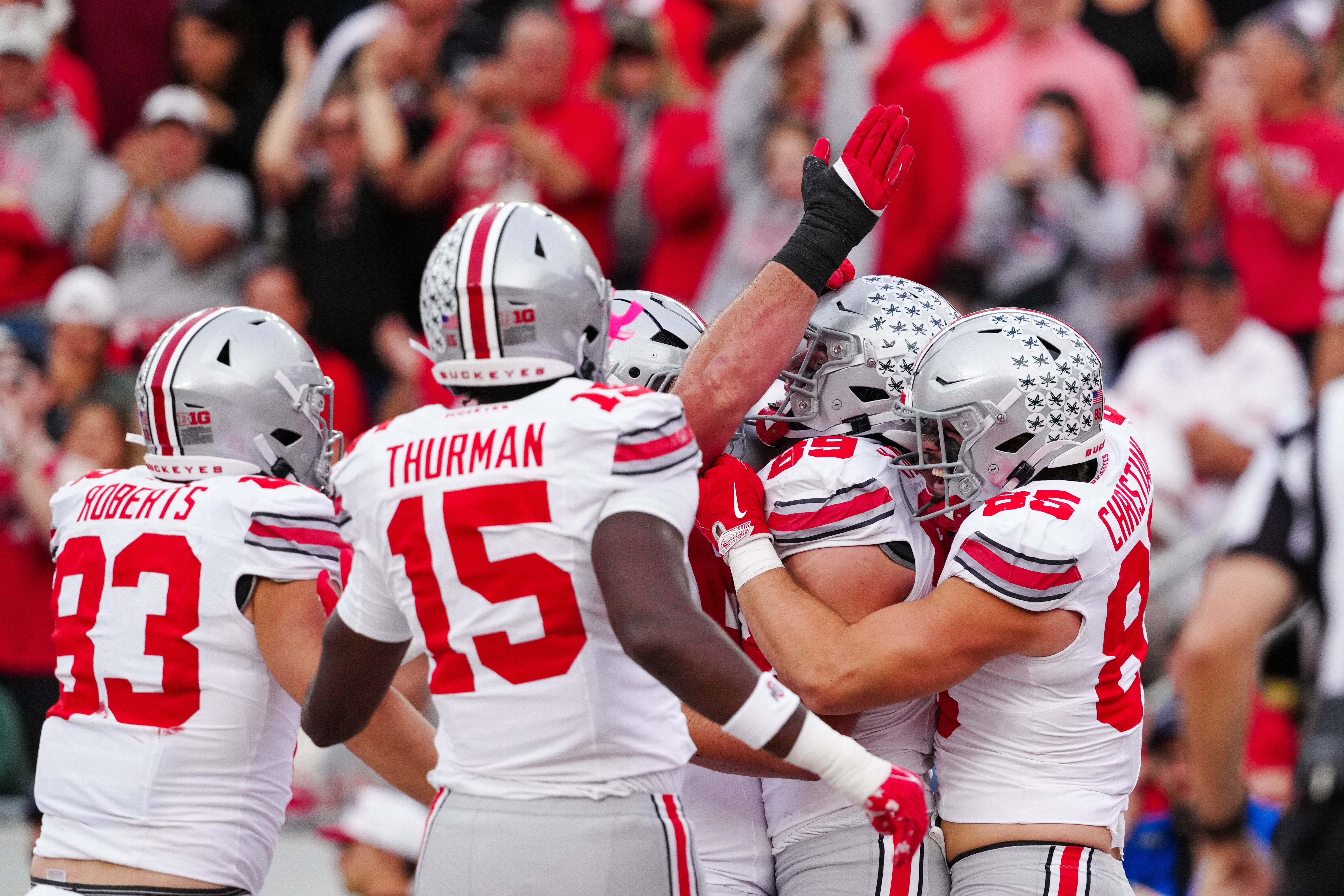 Oct 18, 2025; Madison, Wisconsin, USA; Ohio State Buckeyes tight end Nate Roberts (83) tight end Jelani Thurman (15)and tight end Bennett Christian (85) celebrate a touchdown by tight end Will Kacmarek (89) in the second half against the Wisconsin Badgers at Camp Randall Stadium on October 18, 2025 in Madison, Wisconsin. Photography by Ross Harried for Second Crop Sports.
