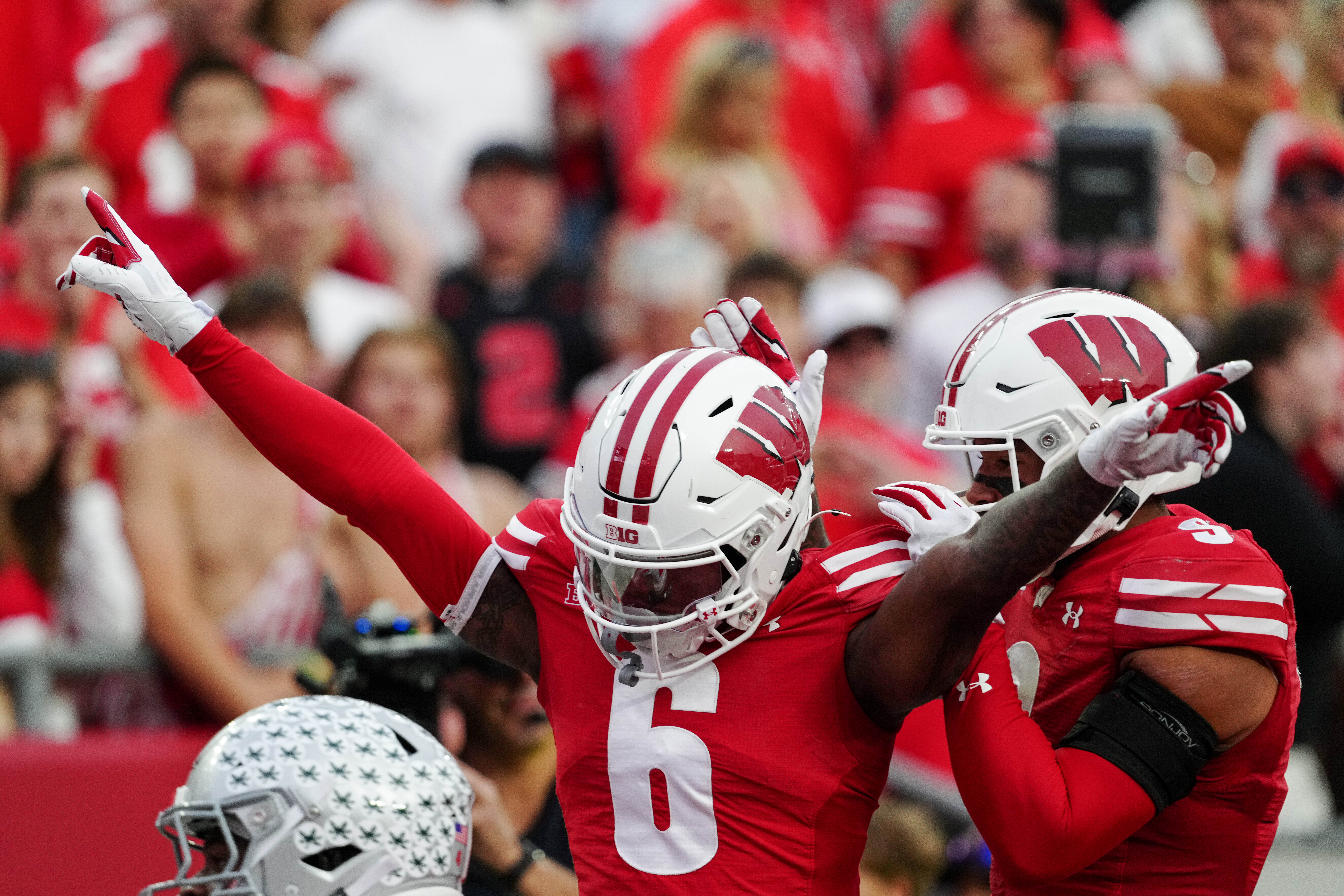 Oct 18, 2025; Madison, Wisconsin, USA; Wisconsin Badgers cornerback Omillio Agard (6) celebrates after knocking down a pass to Ohio State Buckeyes wide receiver Jeremiah Smith (4) in the end zone during the second half at Camp Randall Stadium on October 18, 2025 in Madison, Wisconsin. Photography by Ross Harried for Second Crop Sports.