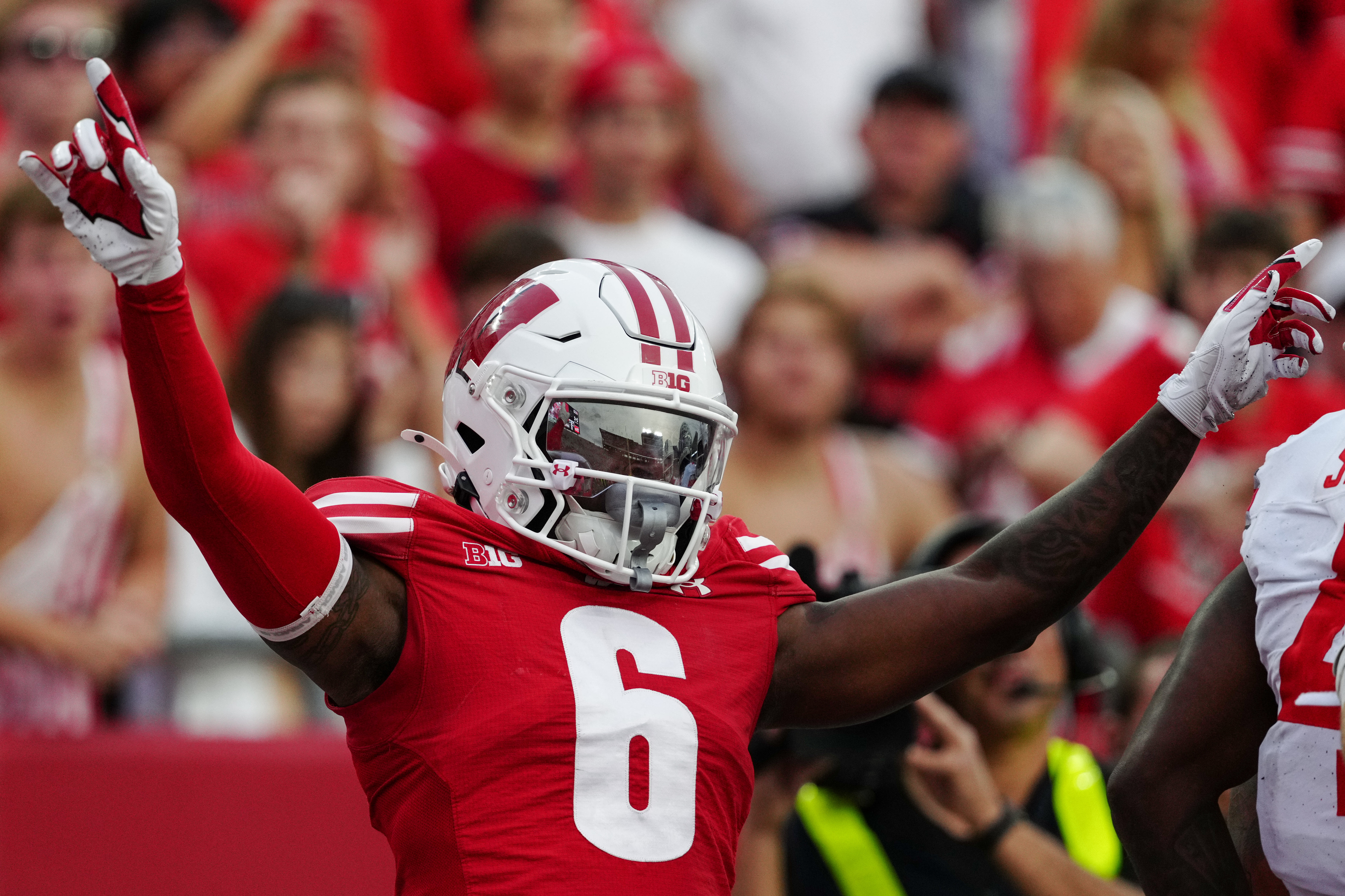 Oct 18, 2025; Madison, Wisconsin, USA; Wisconsin Badgers cornerback Omillio Agard (6) celebrates after knocking down a pass to Ohio State Buckeyes wide receiver Jeremiah Smith (4) in the end zone during the second half at Camp Randall Stadium on October 18, 2025 in Madison, Wisconsin. Photography by Ross Harried for Second Crop Sports.