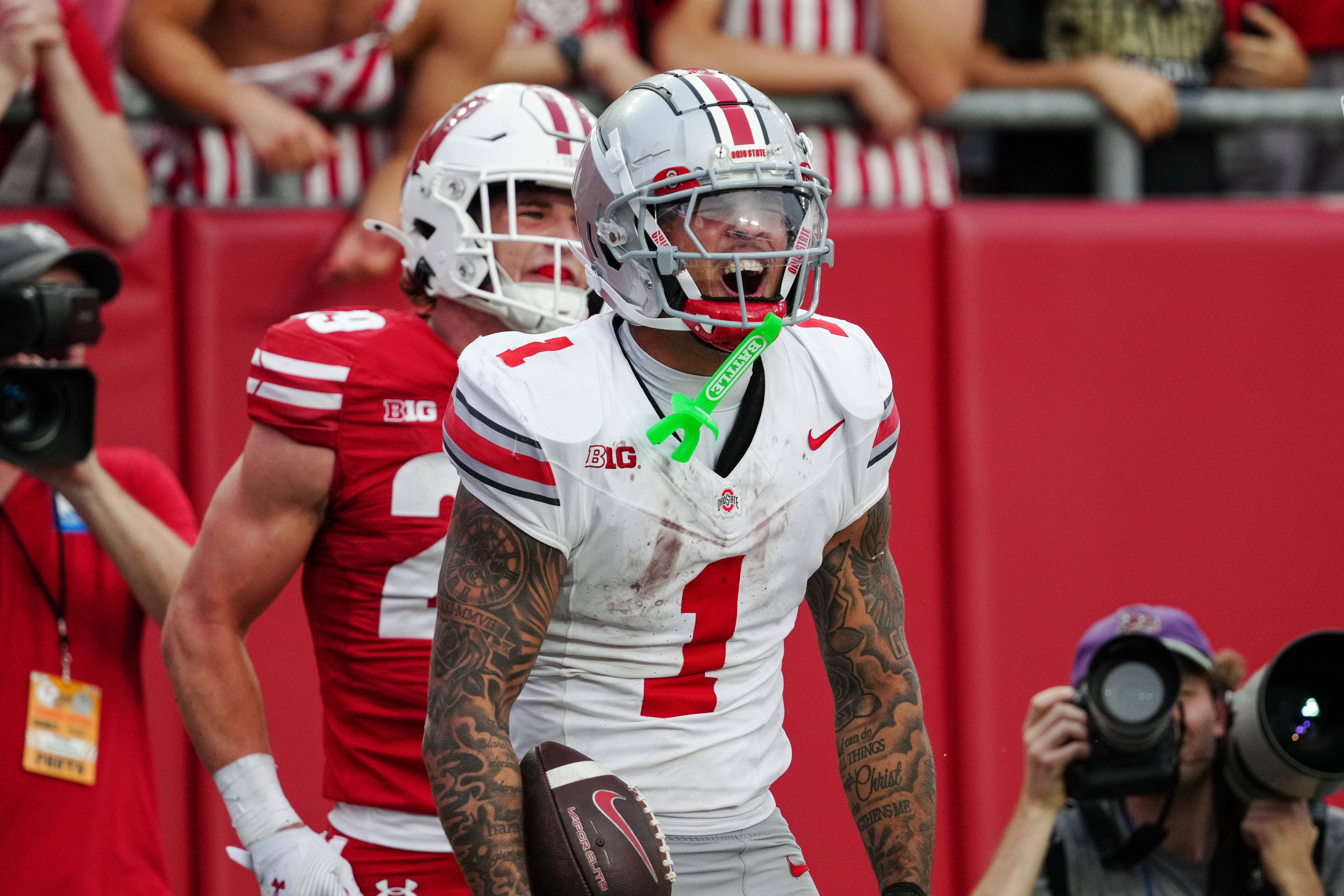 Oct 18, 2025; Madison, Wisconsin, USA; Ohio State Buckeyes wide receiver Brandon Inniss (1) celebrates after catching a touchdown pass in the second half against the Wisconsin Badgers at Camp Randall Stadium on October 18, 2025 in Madison, Wisconsin. Photography by Ross Harried for Second Crop Sports.