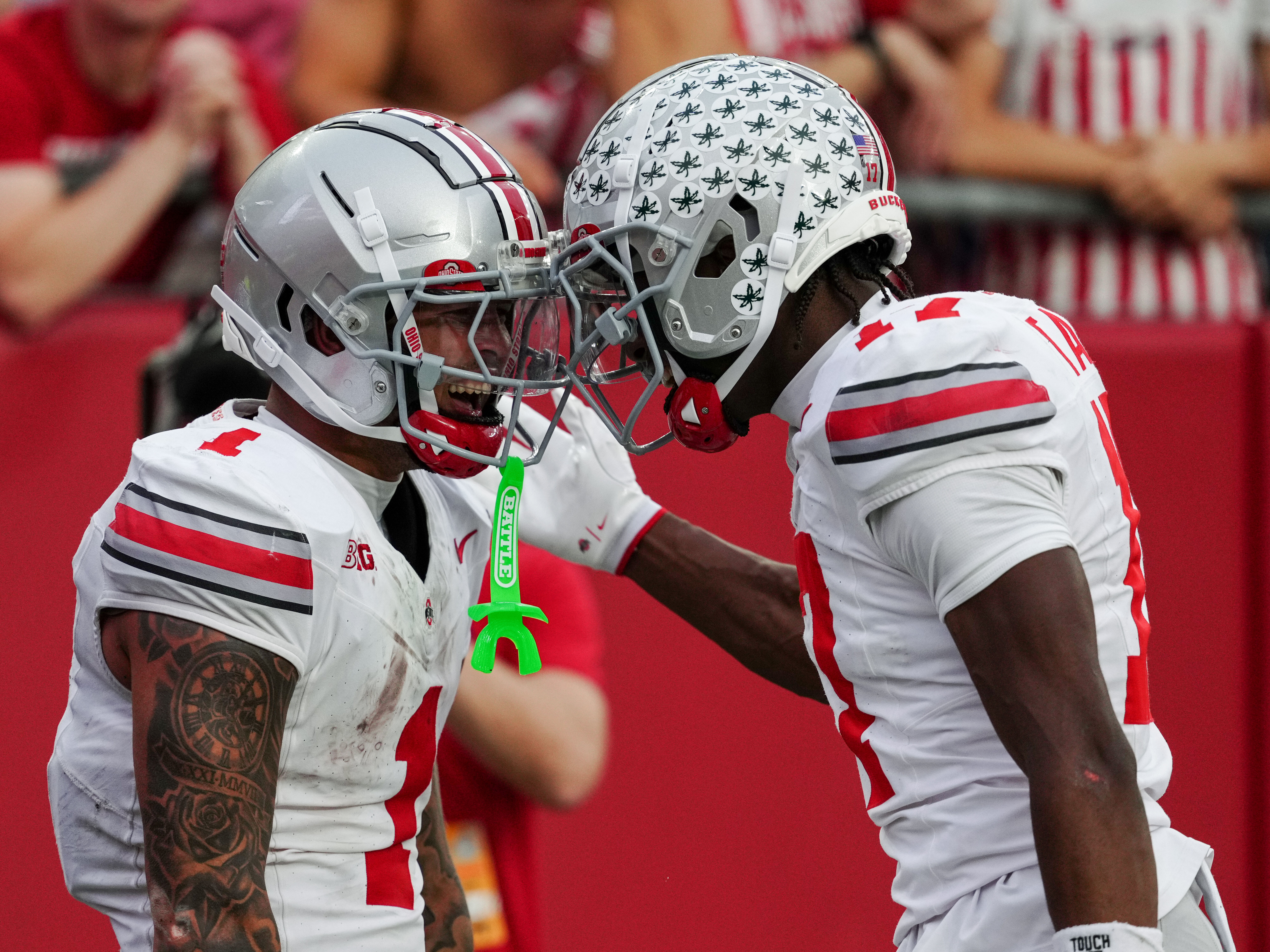 Oct 18, 2025; Madison, Wisconsin, USA; Ohio State Buckeyes wide receiver Brandon Inniss (1) celebrates with wide receiver Carnell Tate (17) after catching a touchdown pass in the second half against the Wisconsin Badgers at Camp Randall Stadium on October 18, 2025 in Madison, Wisconsin. Photography by Ross Harried for Second Crop Sports.