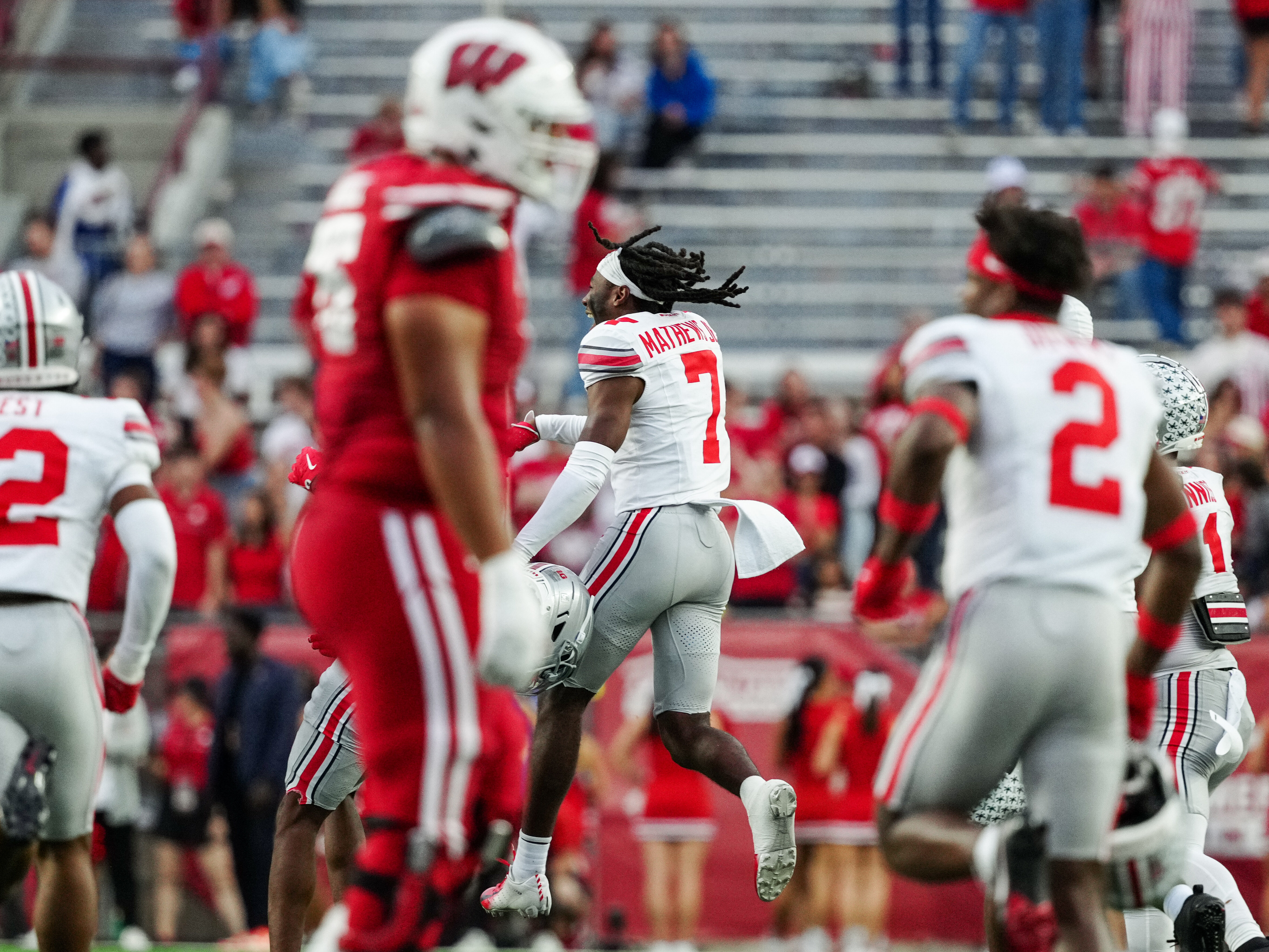 Oct 18, 2025; Madison, Wisconsin, USA; Ohio State Buckeyes cornerback Jermaine Mathews Jr. (7) jumps in celebration of a shut out win against the Wisconsin Badgers at Camp Randall Stadium on October 18, 2025 in Madison, Wisconsin. Photography by Ross Harried for Second Crop Sports.