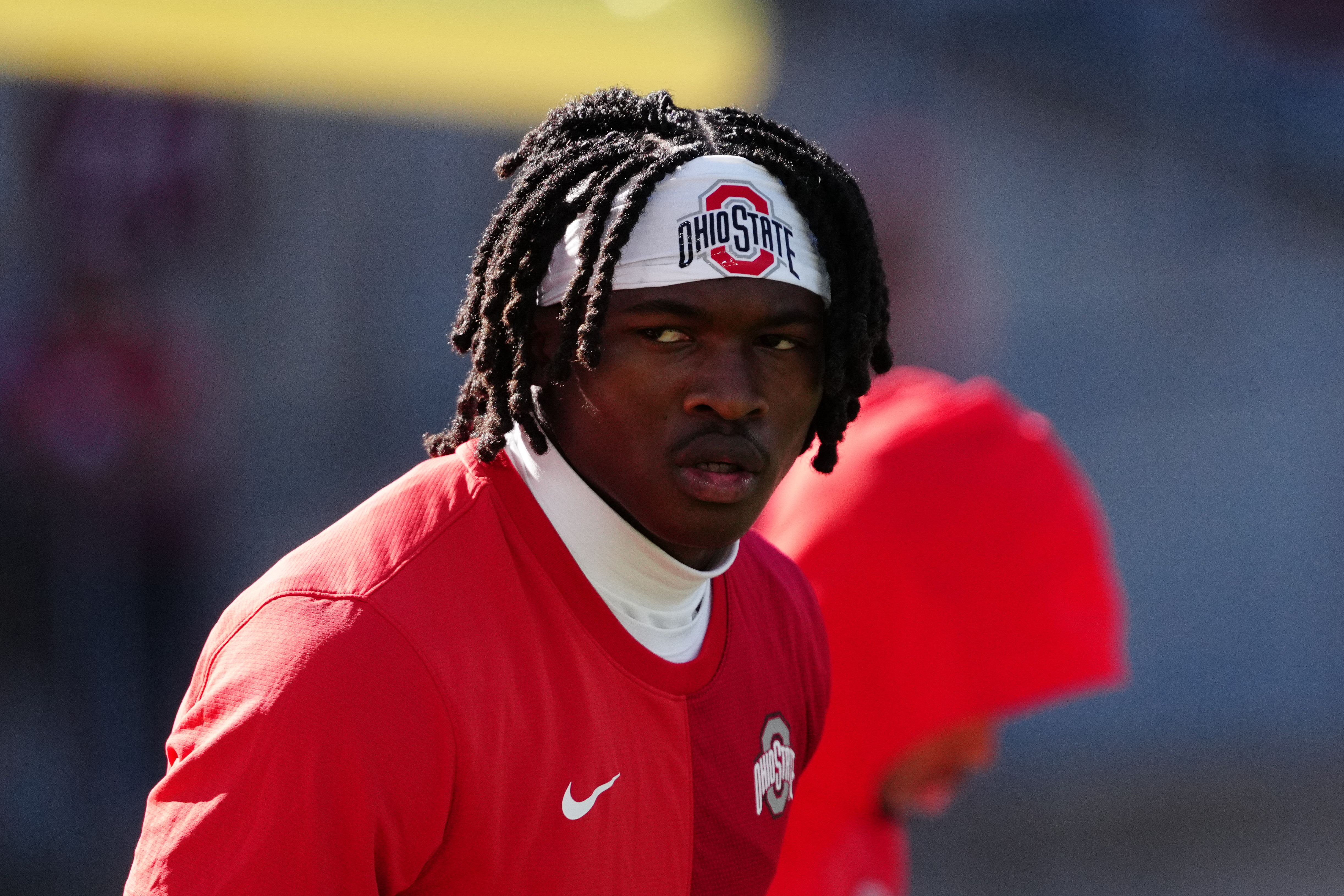 Oct 18, 2025; Madison, Wisconsin, USA; Ohio State Buckeyes wide receiver Jeremiah Smith (4) warms up before a college football game between the Wisconsin Badgers and the Ohio State Buckeyes at Camp Randall Stadium on October 18, 2025 in Madison, Wisconsin. Photography by Ross Harried for Second Crop Sports.
